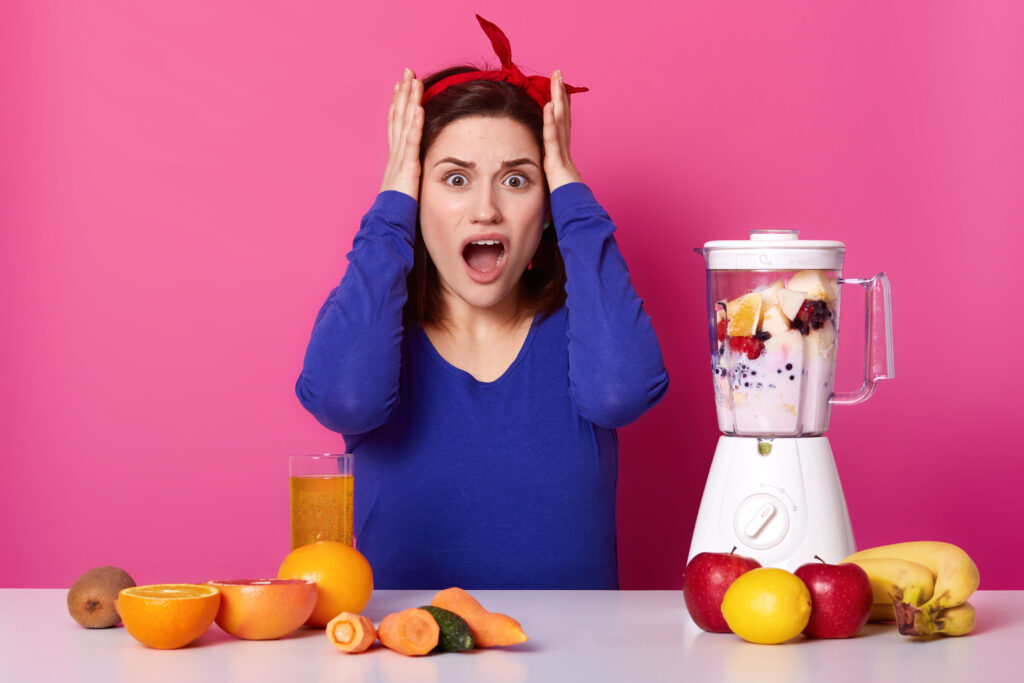 a surprised beautiful woman keeping her hands on head as she is surrounded by all the fruits and veggies